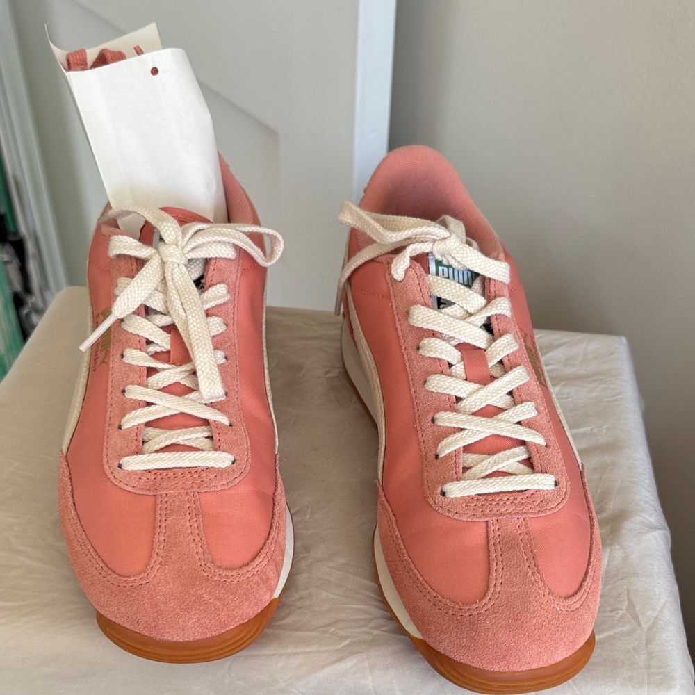 New without tags Puma Coral Pink Low-Top Sneakers with Cream Laces. Never worn